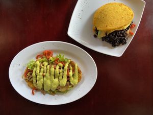 Bob Marley (Patacón pisa’o with vegetables) and arepa with red beans and vegetables  at Quero Arepa in Cartagena