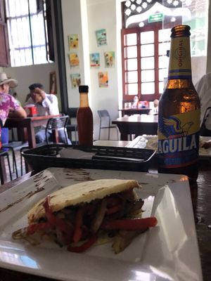Violeta Parra arepa with Colombian beer at Quero Arepa in Cartagena