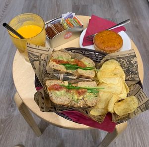 Custom bagel (avocado, hummus, spinach and tomato), vegan carrot cake, and fresh pressed juice.   at The Coffee Box in Padua