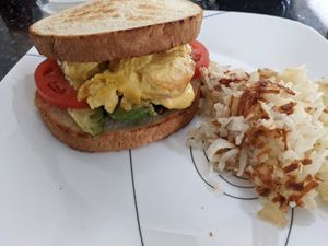 Vegan breakfast sandwich and hash browns at Anna's House in Ann Arbor