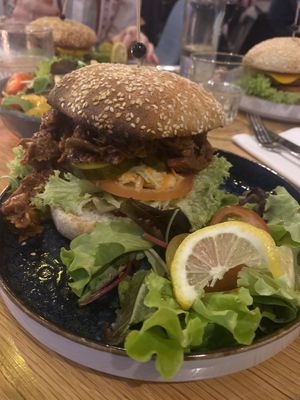 Jackfruit burger and two aloha burgers in the back! All Vegan at Aloha in Leiden