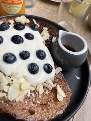 French Toast with Yoghurt, Almonds, Blueberries and Sirup 🫐  at Chapter One Coffee Shop in Edinburgh