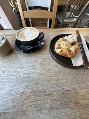 Flat white and vanilla crown  at Chapter One Coffee Shop in Edinburgh