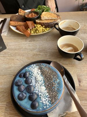 Blue smoothie bowl and a full breakfast   at Chapter One Coffee Shop in Edinburgh