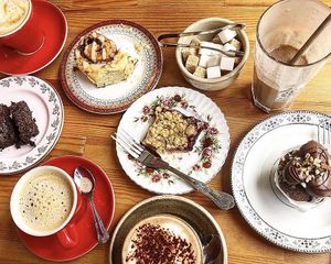 Coffees, a mocha, cinnamon bun, brownie, hazelnut cupcake and fruit crumble slice!  at Chapter One Coffee Shop in Edinburgh
