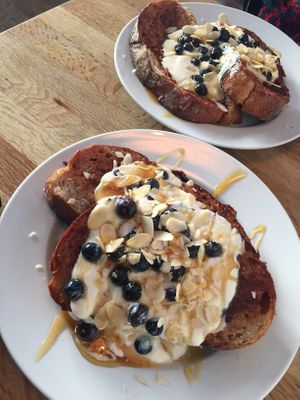 French Toast with almond yoghurt, maple syrup, almond Splits and blueberries 🍞 at Chapter One Coffee Shop in Edinburgh