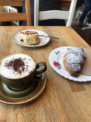 Cappuccino, blueberry croissant and cinnamon swirl at Chapter One Coffee Shop in Edinburgh