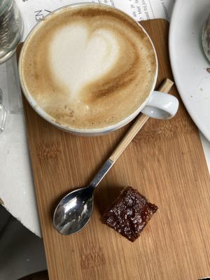 Cappuccino with tasty piece of cinnamon bun   at Plenty in The Hague