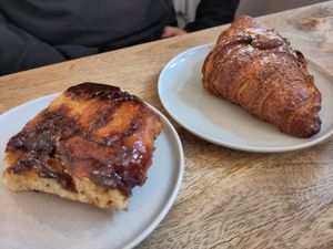 Cinnamon bun and almond croissant (croissant was served warm) at Plenty in The Hague