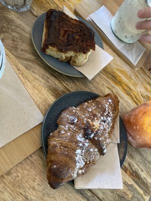 Almond croissant and cinnamon roll  at Plenty in The Hague