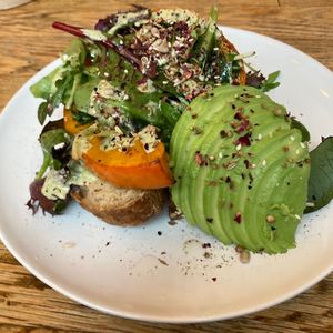 Pumpkin bread with additional avocado   at Plenty in The Hague
