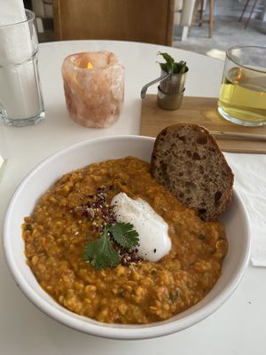 Dahl stew: tasty. The piece of bread is small for such a big bowl of dahl, but there is also rice in the stew. at Plenty in The Hague