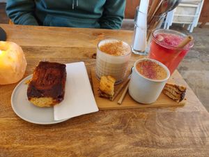 Cinnamon roll, chai latte, ceremonial cacao, rose lemonade at Plenty in The Hague