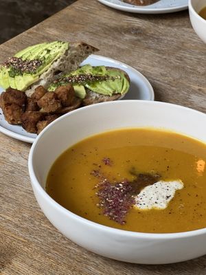 Soup of the day (winter squash) with avocado sandwich and a side of tempeh  at Plenty in The Hague