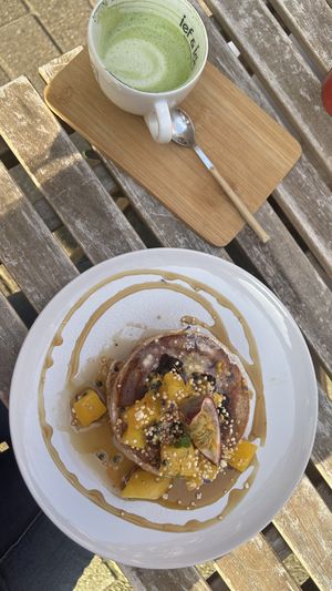 Pancakes and oat matcha lattee  at Plenty in The Hague