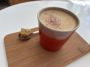 Golden choco latte: it’s quite bitter. The piece of cardamon cake was quite good. at Plenty in The Hague