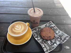 Oat milk cappuccino, vegan cookie, power Mike   at Juice Dudes in Barcelona