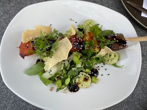 Skewer with miso marinated sweet potato, zucchini and eggplant. Served with a salad with edamame, rice and a edamame-lime cream.  at Brasserie BLVD in Vlissingen