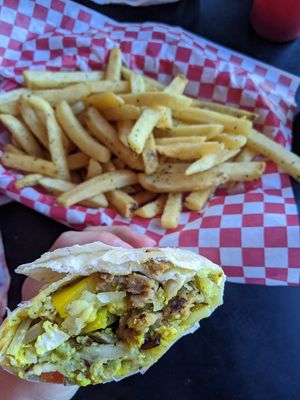 Breakfast burrito (tofu scramble, sausage, peppers, mushrooms, cheese) and add on fries at Mark of the Beastro in Salt Lake City