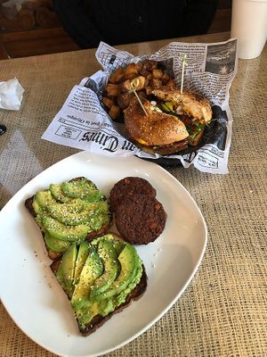 Smashed Avocado Toast with a side of Vegan Sausage.  Veggie sandwich on an Everything Bagel minus the goat cheese with a side of Breakfast Potatoes. at Downtown Deli & Donuts in Spartanburg