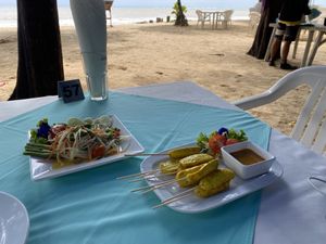 vegan som tam (papaya salad) and tofu satay  at Phen's Restaurant in Phuket
