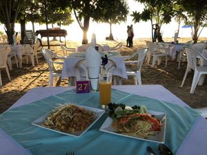 Pad Thai and Papaya Salad on their beach seating. at Phen's Restaurant in Phuket