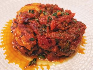 No-chicken with typical Spanish tomato sauce. Slow cooking vegan food you can find in the vegan tour! at Madrid Vegan Tours in Madrid