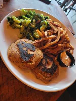 Vegan crab cake platter with vegan remoulade, broccoli, and fries at Dewey Beer Co in Dewey Beach