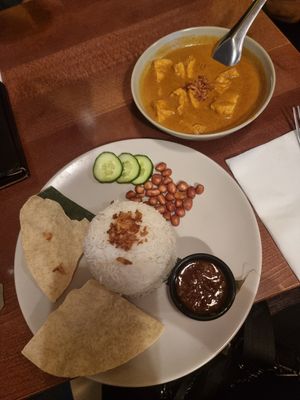 Curry with coconut, pandan, spices with the complimentary rice. Vegan. Tofu cooked separately to meat. at Kuala Lumpur Café in Leeds