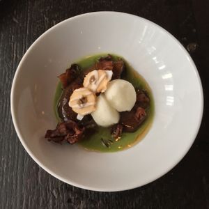 Veggies for dessert! Eggplants Foster cooked tableside with basil sauce, lemon ice, and eggplant thumbprint cookies.  at Dirt Candy in New York City
