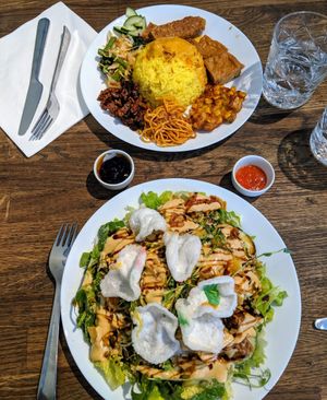 Mixed plate (top) with tofu, tempeh, noodles, rice and more I can't remember exactly. Sallad (bottom) with tofu, tempeh, rice, potato and peanut sauce. at Sayur in Gothenburg