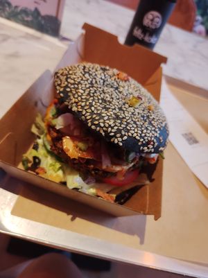 Burger. Nice vegan cheese. Slightly spicy sauce. Lotta toppings at Vegan Heroes in Eindhoven