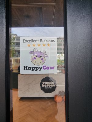 Happy cow window sticker at Vegan Heroes in Eindhoven