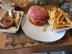 Delivery, fries, kimchi burger, and curry love bites at Vegan Heroes in Eindhoven