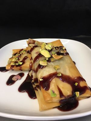 Carmelized onion and ricotta strudel with black currant drizzle and pistachios  at Plantitude in Ladysmith