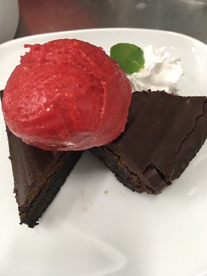 Chewy chocolate brownie with raspberry sorbet and coconut whip  at Plantitude in Ladysmith