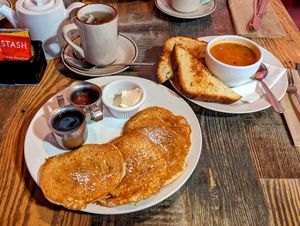 Hotcakes, cup of chickpea stew, and hot tea. at High Note Cafe in Boise