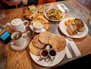 Hot tea, spinach dip, loaded nachos (half size), Philly breakfast burrito, blueberry pancakes, and potato leek soup. at High Note Cafe in Boise