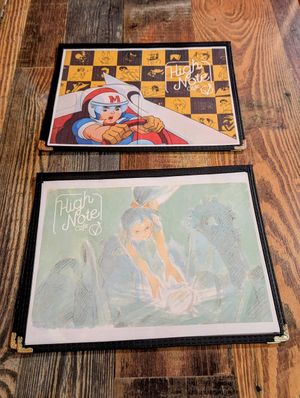 Fun anime menu covers! at High Note Cafe in Boise