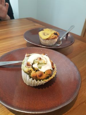 Vegan muffin. Matcha and chocolate chip with coconut icing or kiwifruit and blueberry muffins. at SLOW Plant Based Cafe in Koshigaya