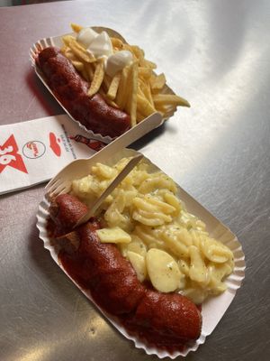 Vegan bratwurst with fries and Bavarian potato salad. Next time, I would go for the fries or bun.  at Curry 36 in Berlin