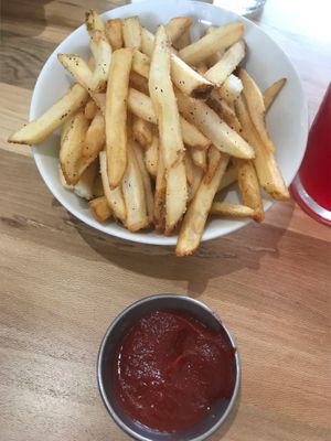 French fries with ketchup  at Verdine in Houston