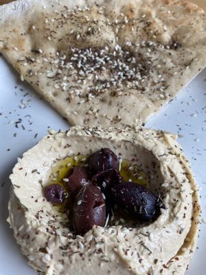 Hummus with gluten free pita 💚  at Verdine in Houston