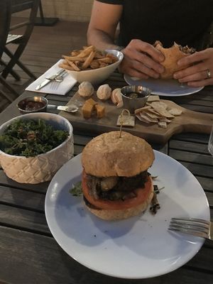 Burgers, fries, kale salad and cheese plater  at Verdine in Houston