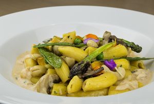 Chipotle curry rigatoni (wild asparagus, field peas, mushrooms, cashew nuts, green peas and chipotle curry) at BLoved Veggie Corner in Madrid