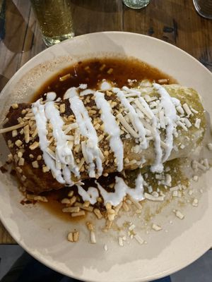 Wet burrito with al pastor and half red sauce half green sauce  at Pancho's Vegan Tacos - Fort Apache in Las Vegas