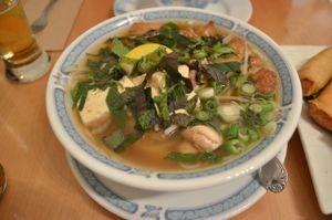 The spicy noodle soups marked on the menu with a star: rice noodles, mushrooms, soy protein, mint, lemon. The broth was delicious. at Vegetarian House in San Jose