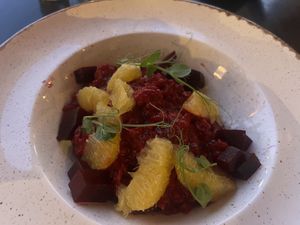 Beetroot risotto with orange slices  at De Governeur in Willemstad