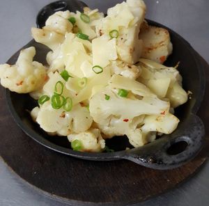 They have a Vegan Roasted Cauliflower with Cashew Cheese Sauce and a Vegetarian one with Parmesan & Gaot Cheese at Conola Grill and Sushi in Metairie