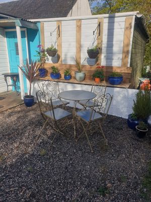 Small outdoor seating for 8 people at Catchacarrot Vegan in Ardfern